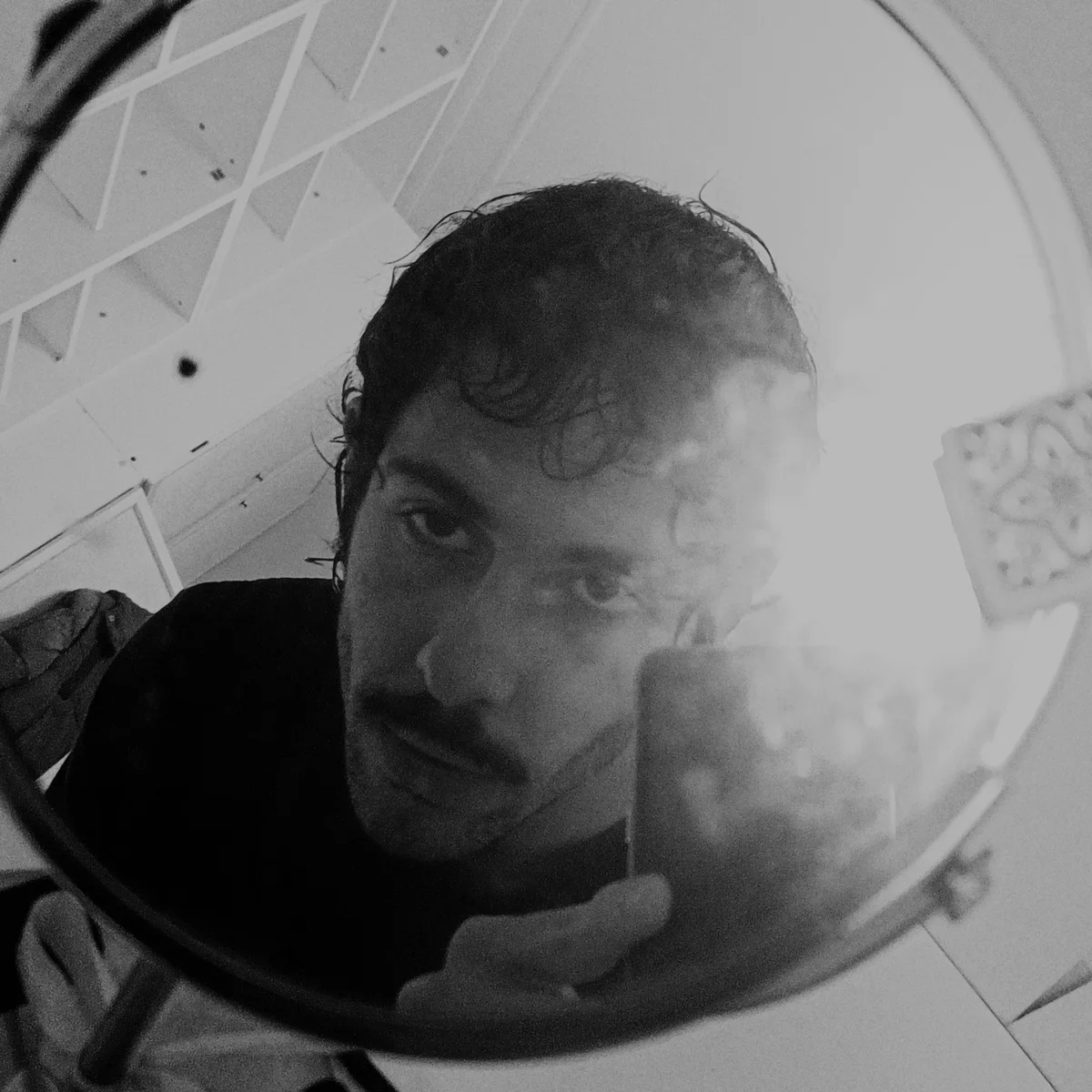 Black-and-white portrait of Ivan Arena.